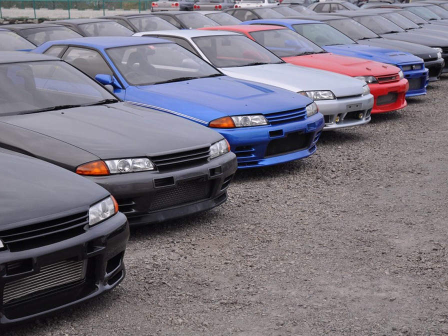 Japanese used cars stock. Cars standing in line in front of our yards in Japan